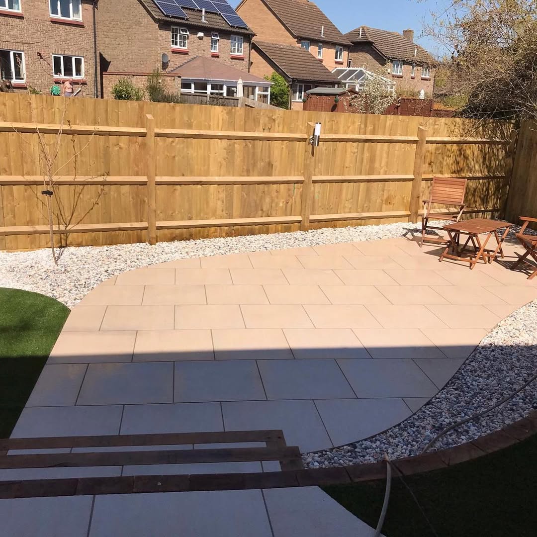 New sandstone porcelain patio with gravel border