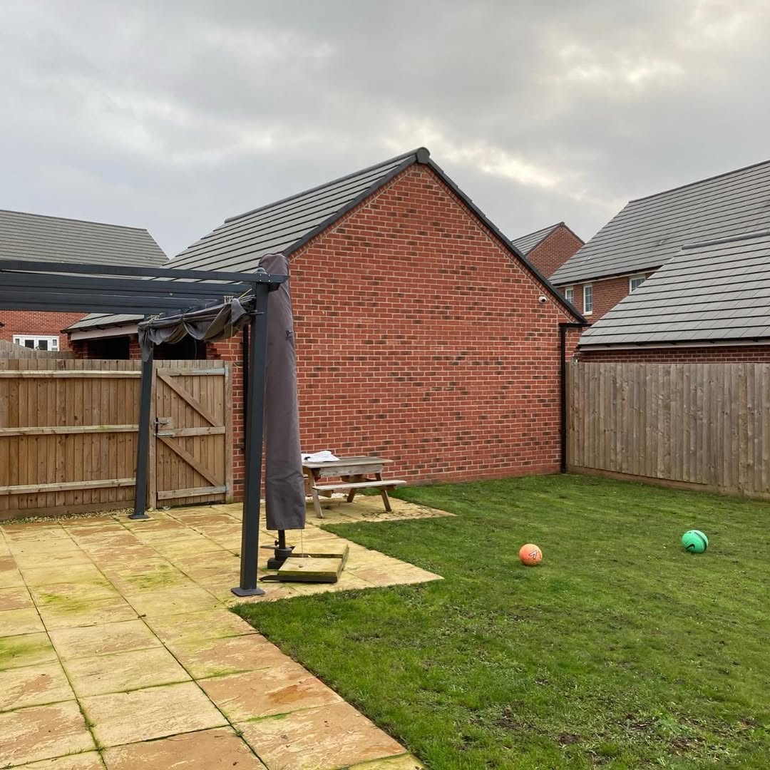 Tired patio and lawn before transformation