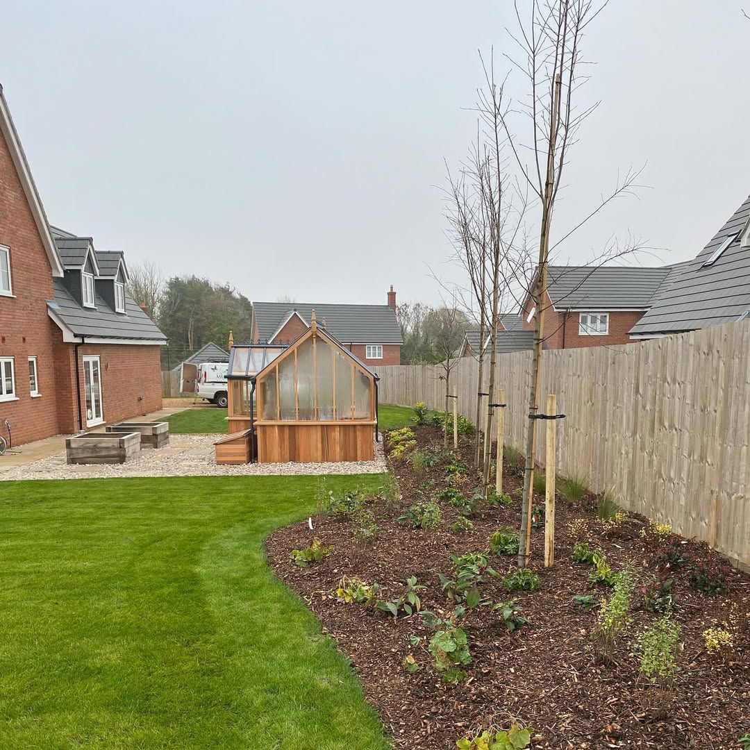 New border running alongside the cedar greenhouse at handover