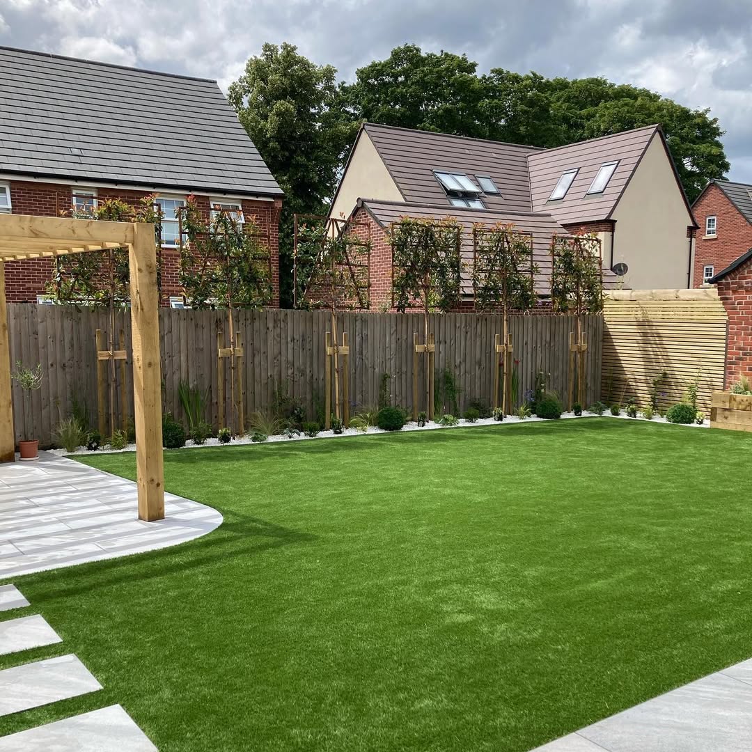Wide view of new lawn with trellis screening