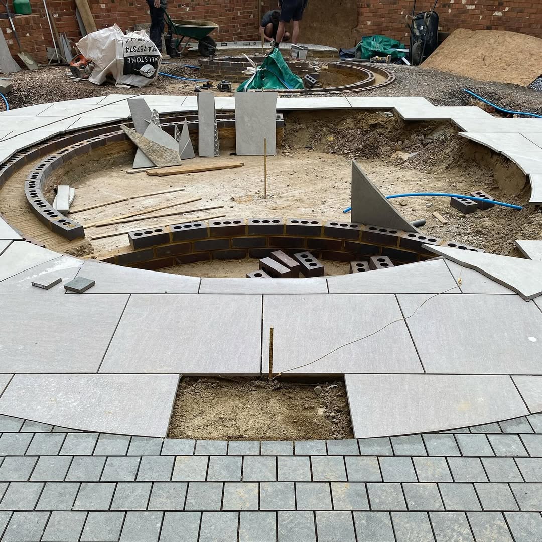 Brick rill walls under construction with porcelain set out